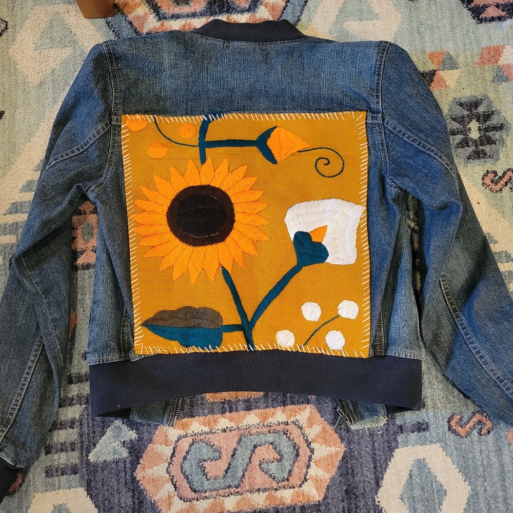Upcycled denim jacket. Size medium. In like new condition. Has stretch.